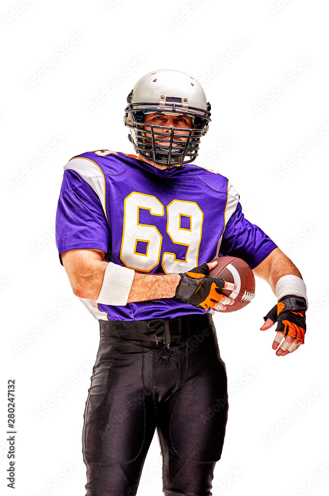 American football player posing with ball on black background. Super Bowl concept. Concept American football, portrait American, Motivator. Black white background, copy space. Isolate