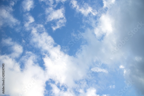 Cumulus clouds on blue summer sky