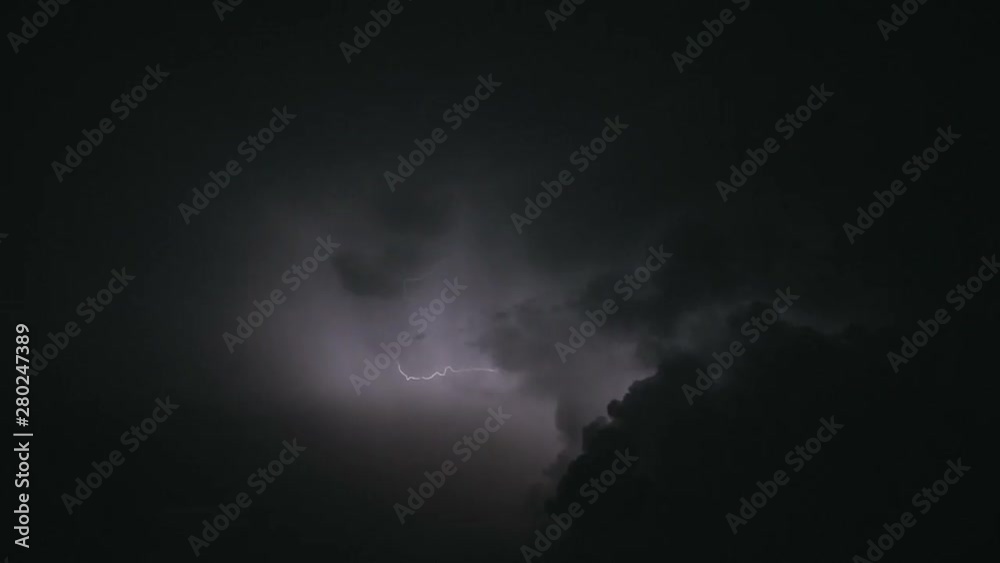 Night stormy sky above city. Set of beautiful lightning strikes. Thunderstorm clouds. Slow motion.