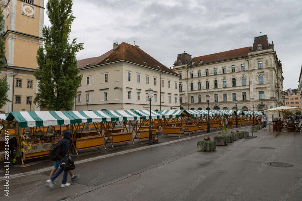 Naklejka premium Ljubljana,Slovenia,6,2016: Street, river, bridges with dragons, magical city.