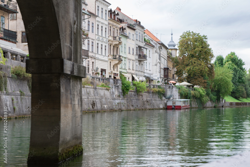 Obraz premium Ljubljana,Slovenia,6,2016: Street, river, bridges with dragons, magical city.