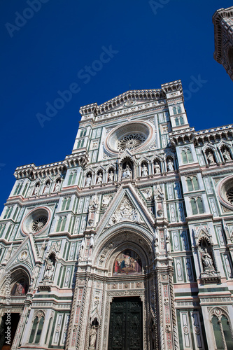 The Giotto Campanile and Florence Cathedral consecrated in 1436 against a beautiful blue sky