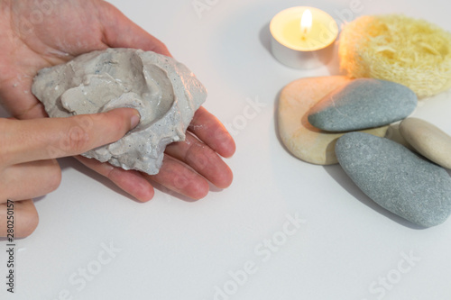 the woman hold Chyle or Argil or clay or sand in the hand at the Salda lake from Turkey. photo