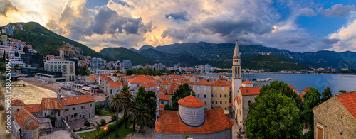 Budva Old Town at sunset from the Citadel with Holy Trinity church, Adriatic Sea and Richard s Head beach in Montenegro photo