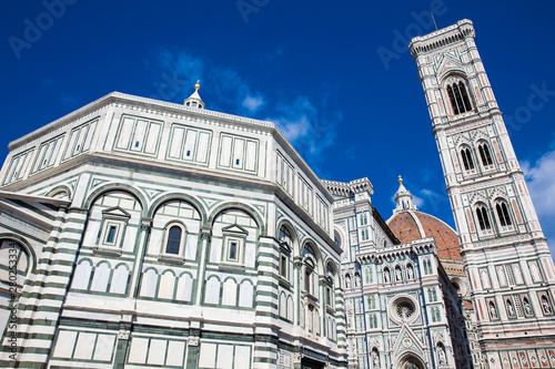 Baptistery of St. John  Giotto Campanile and Florence Cathedral consecrated in 1436 against a beautiful blue sky