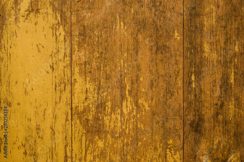 Grunge old yellow painted planks with wood texture .
