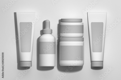 Set of white cosmetic make up packaging bottles, tubes and jars on white background