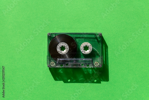 Bild auf Leinwand transparent audio cassette tape on a green background