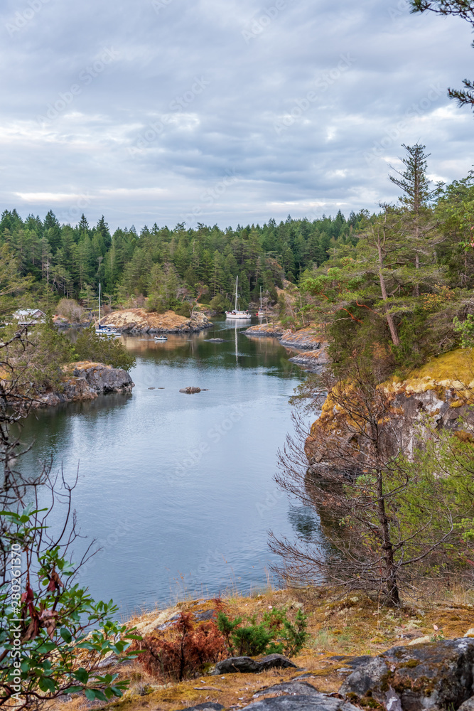 Fototapeta premium View over Inlet, ocean and island with rocks in beautiful British Columbia. Canada.