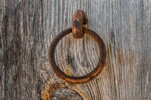 Fotografie iron ring on a wooden boards background