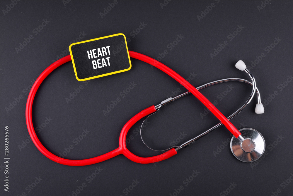 Stethoscope on black background with text. MEDICAL CONCEPT Stethoscope on black background with text. MEDICAL CONCEPT