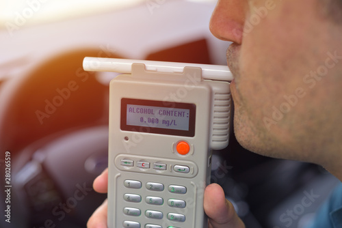 Driver due to being subject to test for alcohol content with use of breathalyzer photo