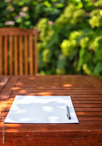 Wooden table with a sheet o...