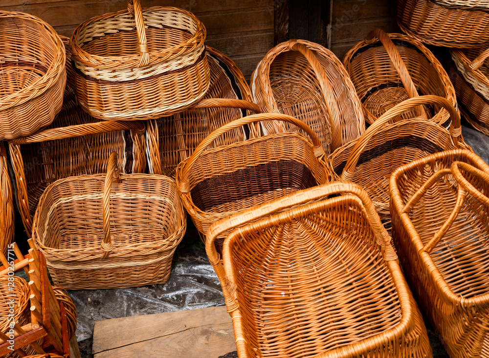 baskets made of hand-made vines grouped for sale at a folk art exhibition baskets made of hand-made vines grouped for sale at a folk art exhibition