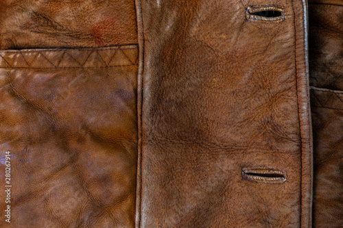 small brown thick seude jacket closeup texture with selective focus and blur photo