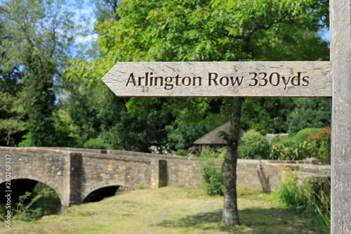 Wooden Sign Post Showing Direction And Distance To Arlington Row In Bibury. Cotswolds. UK