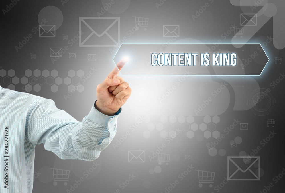 Obraz premium Business man touch a button on an imaginary screen with text CONTENT IS KING