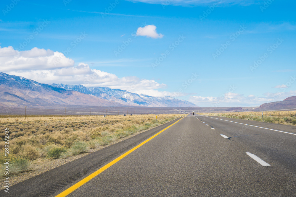 Typical highway in California, surrounded by deserts and mountains, United States