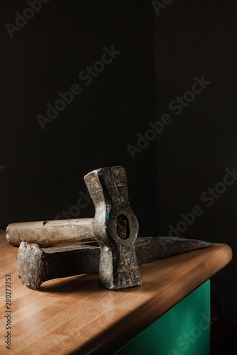 WORK TOOLS ON WOODEN TABLE