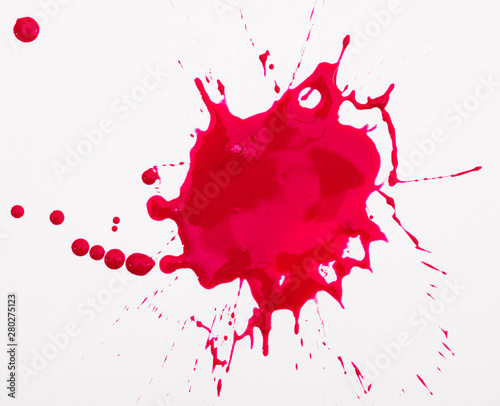 Red ink blot on white background