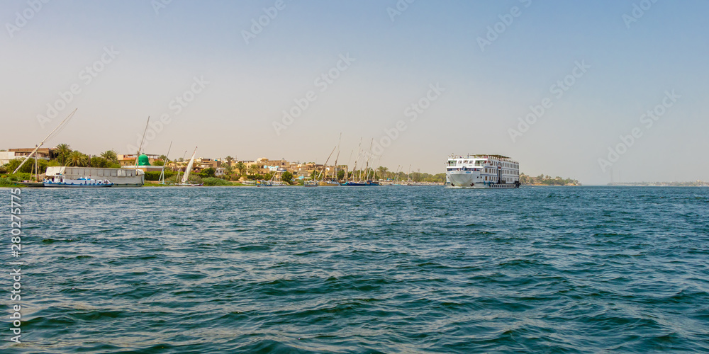 Luxor, Egypt - April 16, 2019: Cruise ship on Nile river, River cruising is a comfortable, luxury hotel-style way, Luxor, Egypt