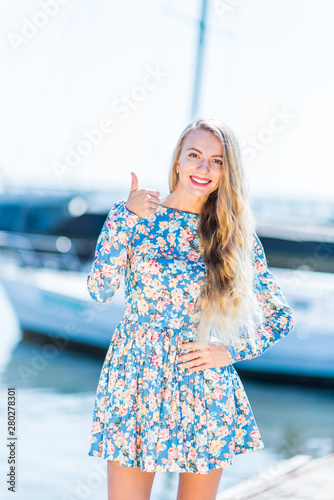 Nice women with flowers near the boat feals happy photo