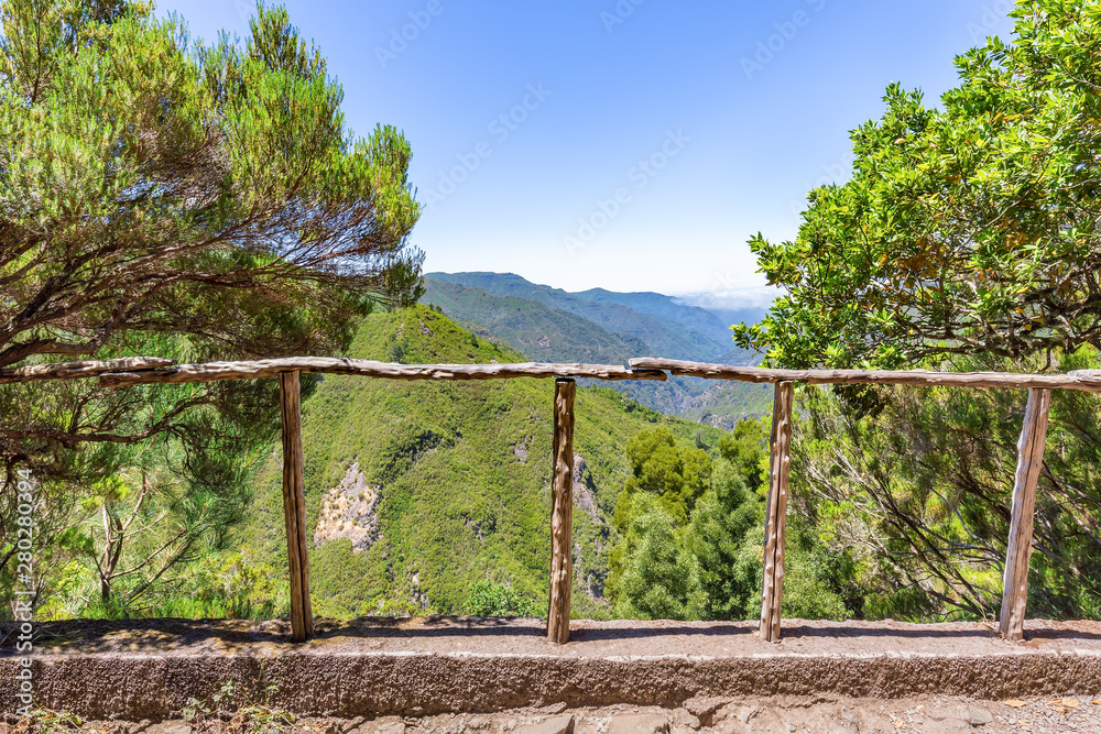 Look through fence with valley and mountainds Look through fence with valley and mountainds