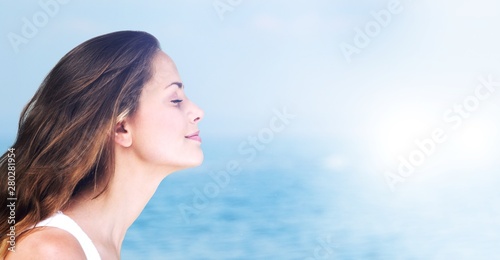 Outdoor summer portrait of pretty young smiling happy woman posing on background