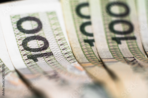 Polish Zloty banknotes (PLN) composition - Closeup on stack 100 PLN banknotes. Macro shot. Business background