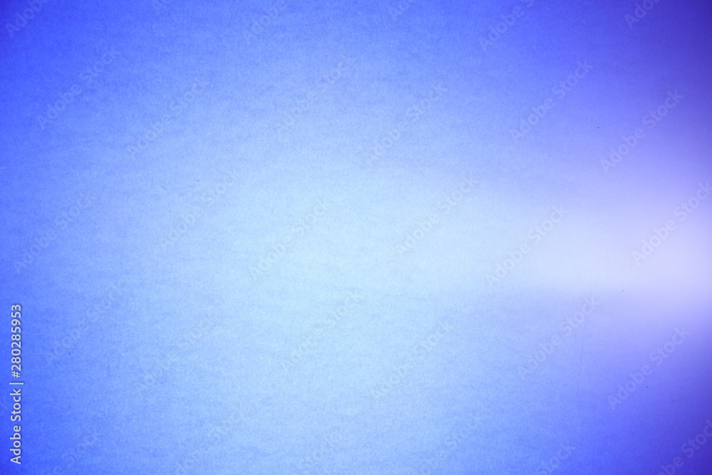 A light purple ray cuts through the textural and semi-blurred light blue background
