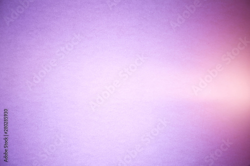 A light pink ray of light cuts through a purple and lilac brutish textural background