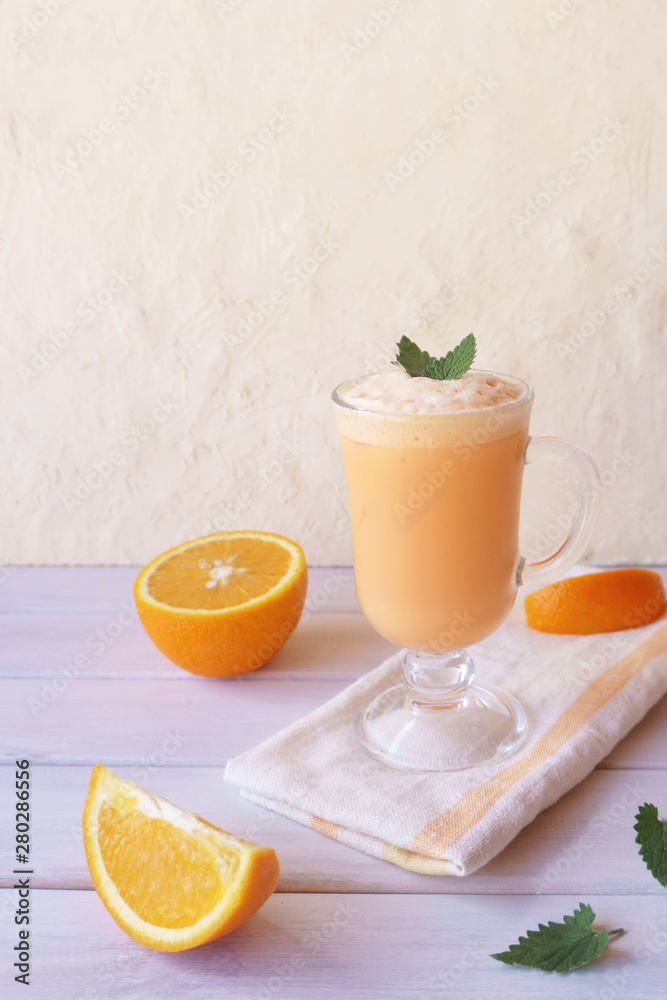 Fototapeta premium orange smoothie, milkshake with orange and mint