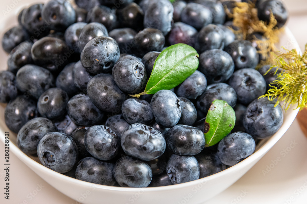Blueberry and sugar in a bowl in the kitchen. Blueberry and sugar in a bowl in the kitchen.