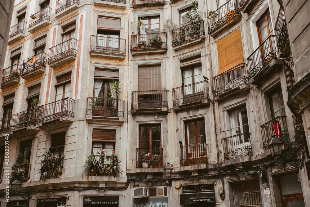 windows and balconies of an apartment building in Barcelona, Spain
