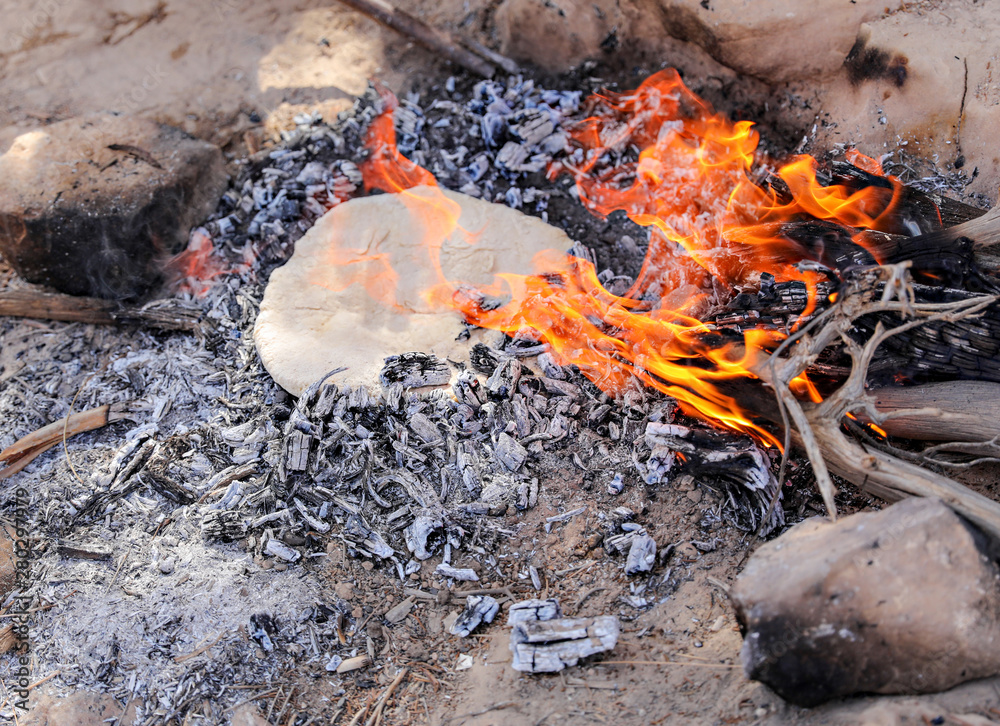 Cooking food, onions, tomatoes and bread, over and open fire. Cooking food, onions, tomatoes and bread, over and open fire.
