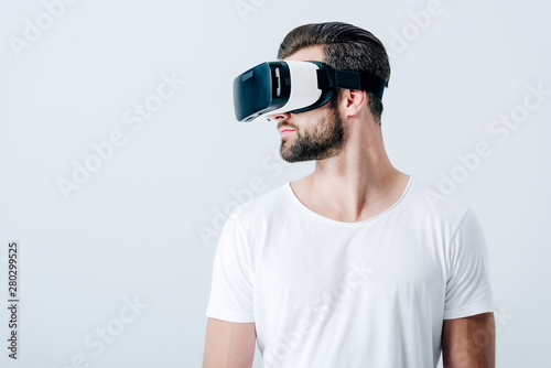 bearded man in Virtual reality headset isolated on grey with copy space © LIGHTFIELD STUDIOS