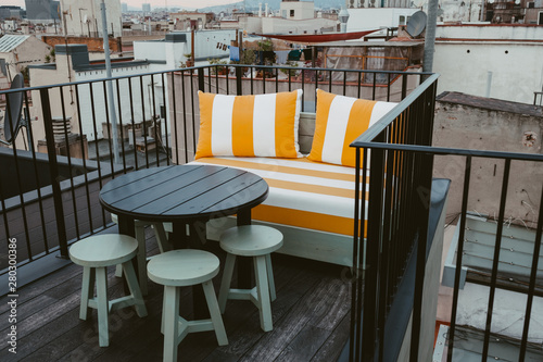 table and chair on a rooftop Barclona, Spain photo