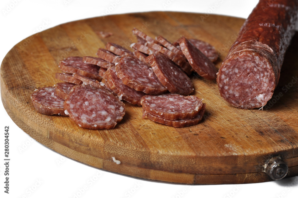Obraz premium Sausage on a wooden board isolated on a white background.Food