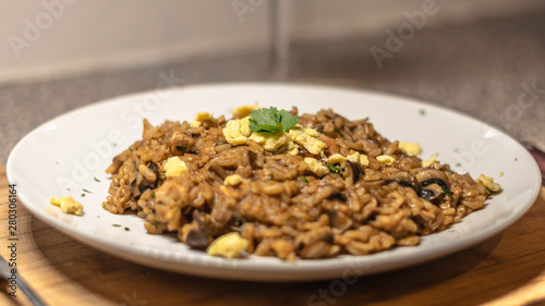 food of rissotto, parsely and egg