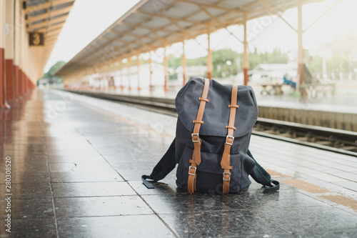 Fototapeta Naklejka Na Ścianę i Meble -  Backpacks on the floor at train station and copy space