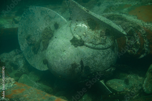 Diving and underwater photography, the ship underwater sunken lies on the ocean floor.