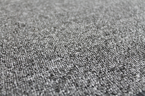 Gray fabric texture abstract background. Textured backdrop as copy space for text. Carpet detailed close up.