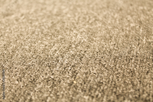 Beige fabric texture abstract background. Textured backdrop as copy space for text. Carpet detailed close up.