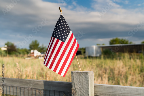 US flag on the wooden fence photo