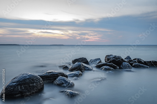 sunset at Willow Beach Georgina Ontario Canada with rocks formation, sky, clouds, light, and lake view © DanielCarson
