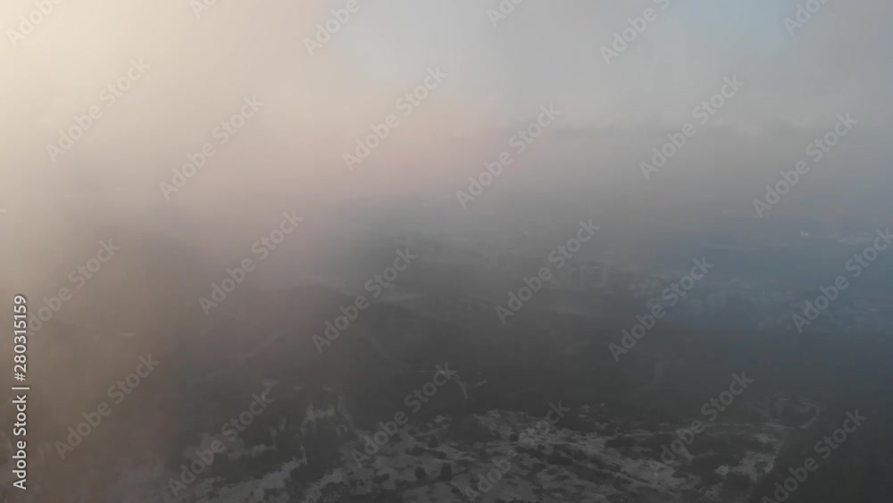 Flying drone through the clouds over the slopes of Mount Carmel, Israel. Flying drone through the clouds over the slopes of Mount Carmel, Israel.