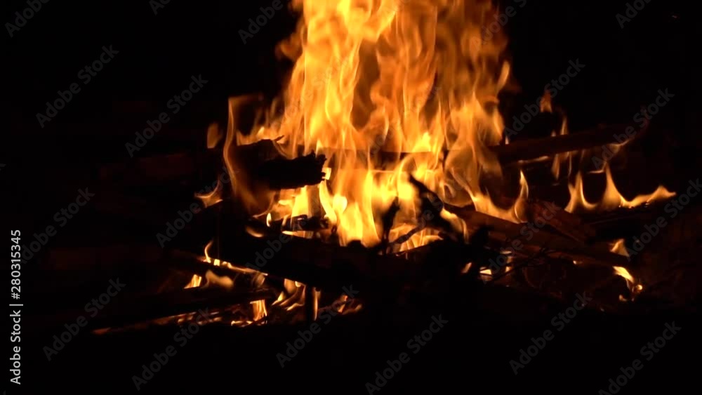 Burning fire. Bonfire. Close Up of flames burning on black background, slow motion Burning fire. Bonfire. Close Up of flames burning on black background, slow motion