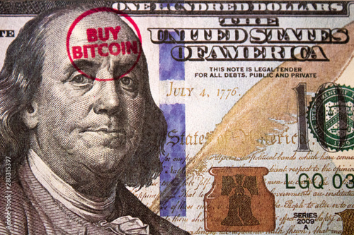 'BUY BITCOIN' stamped on fiat 100 dollar bill