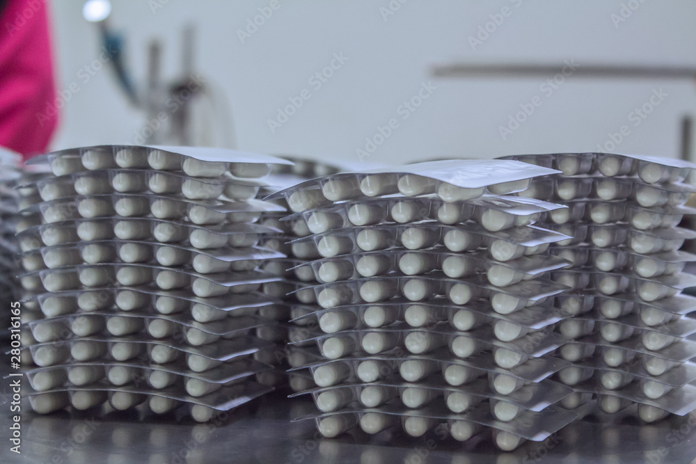 Capsule production process in factory. Capsule production process in factory.