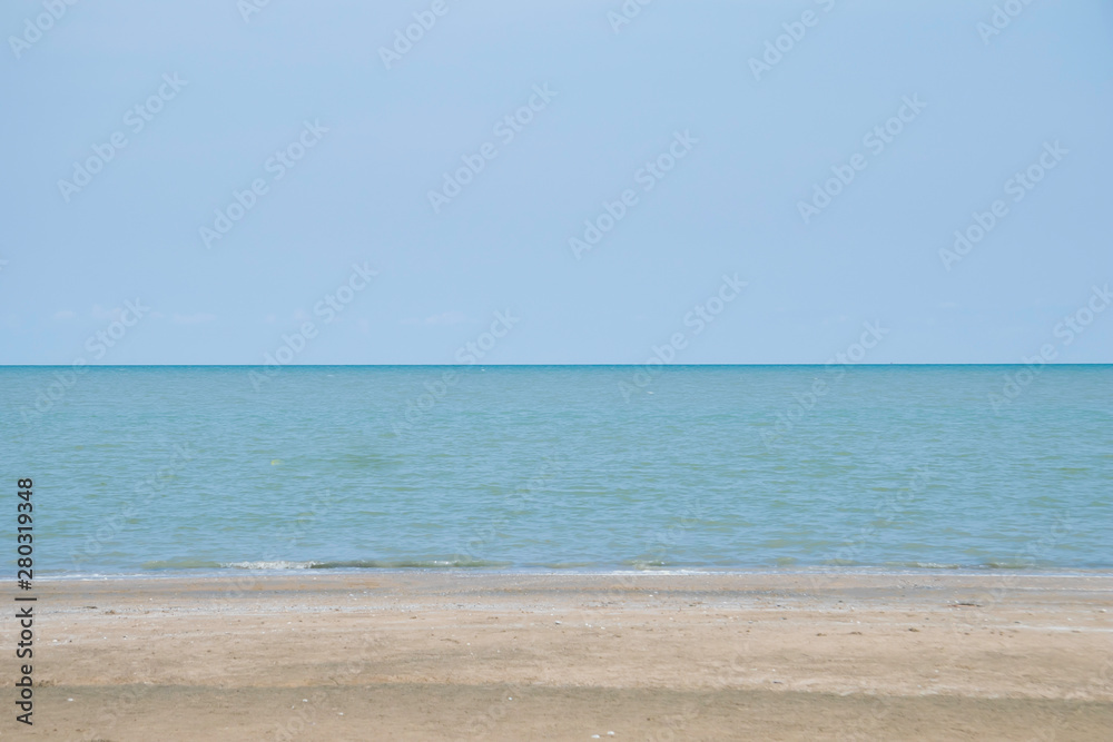 Beautiful sea beach with sun light reflection and bubble foam of sea wave with copy space